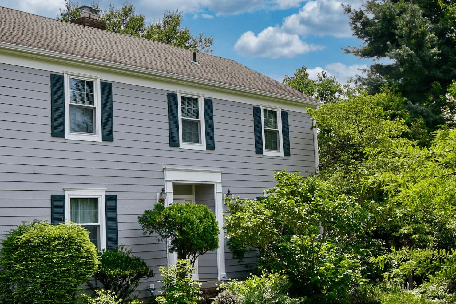 classic-home-exterior-renovation-roi-landscaping.webp